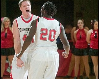The Vindicator/Geoffrey Hauschild
YSU's Vytas Sulskis (44) and teamate Ashen Ward (20) bump chests in in celebration while leading by ten points during the second half of a game against High Point University at Beeghley Center on Tuesday evening.