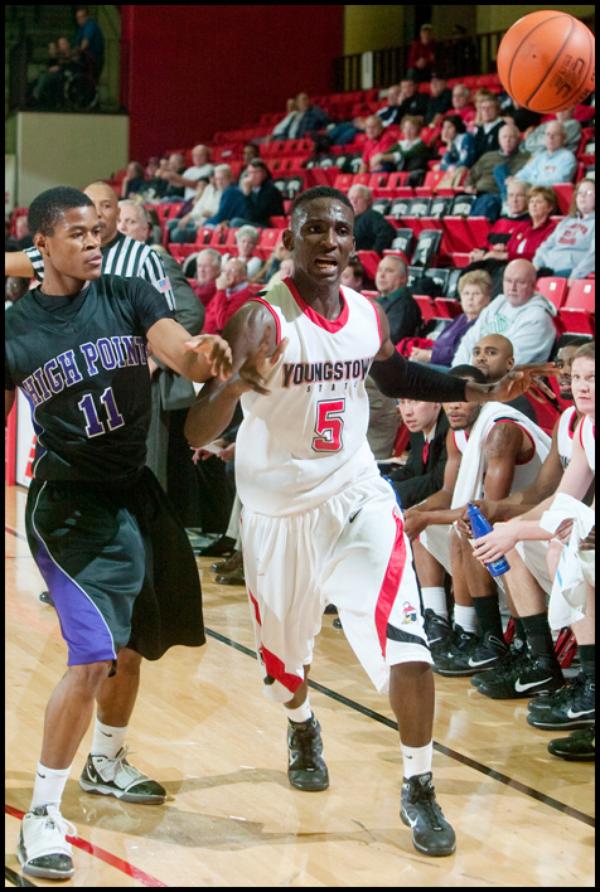 The Vindicator/Geoffrey Hauschild
YSU's Sirlester Martive (5) loses control of the ball while defended by High Point University's David Singleton (11) during the second half of a game at Beeghley Center on Tuesday evening.