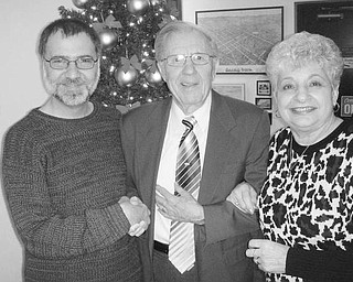  Special to The Vindicator
HOLIDAY EVENT: Salem Historical Society installed officers for 2010 during its December meeting. David Shivers, at left, congratulates Lou Raymond, newly installed president, and Judi Allio, who was installed as vice president. Their associate officers will be Judy White, recording secretary; Dixie Gordon, corresponding secretary; Lisa M. Baird, treasurer; Steve Faber, Kevin Shafer and Virginia Wilms, three-year trustees; Janice Lesher, curator; and David Stratton, director. A program, “Holiday Traditions,” was presented by Christopher Kenney, educational director at the McKinley Museum in Canton. The society will participate in First Night Salem activities by displaying a variety of lights. Anyone interested in lending a light for the display is asked to contact (330) 337-8514.
