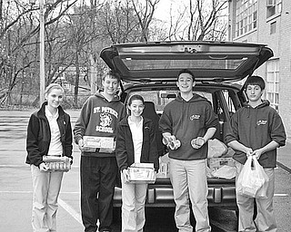 Special to The Vindicator
END OF DRIVE: The eighth-grade class at St. Patrick School has completed a series of drives during which food was collected for the St. Vincent de Paul Society Food Bank at St. Patrick Church in Hubbard. Above from left, Emily Frazzini, Joe Sebest, Alexandra Colacino, Nick Ezzo and Vince Seffera show a few of the items they helped to collect and to deliver to St. Vincent de Paul along with a check for $100 to be used to purchase additional food for the needy.