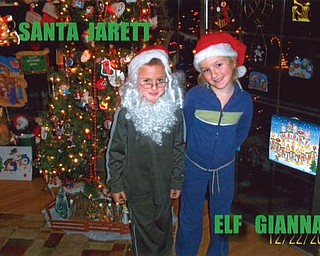 LITTLE LOOK-ALIKES: Gianna, 6, and Jarett, 5, Gordulic are in front of the tree at their Grandma and Grandpa Gordulic's home in Canfield.