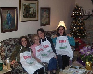 A DIFFERENT KIND OF FAMILY TREE: Christina Smith of Canfield presented her aunt, Geri DeCenso; her grandmother, Margaret Orlando (who is turning 90 in May); her mom, Mary Jo Olson; and her aunt, Jackie Orlando of Columbus, with aprons celebrating their cooking and the roots of their Italian heritage.