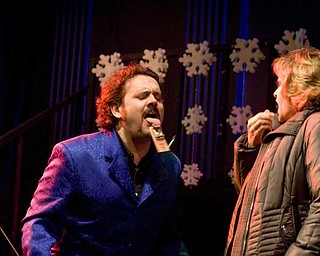 The Vindicator/Lisa-Ann Ishihara --- Travis -one half of the Pickled Brothers - has volunteer Christy Barnes of Niles help him with snapping his tongue with a mouse trap - during the bros performance at the Oakland Center for the Arts during First Night Youngstown 2010