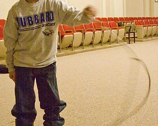 The Vindicator/Lisa-Ann Ishihara ---
Robbie Gessler (8) of Coitsville Township gets a free rope for volunteering during Richard and Donna Best's Black Lightning Wild West Show
on the second floor of the Masonic Temple during First Night Youngstown 2010