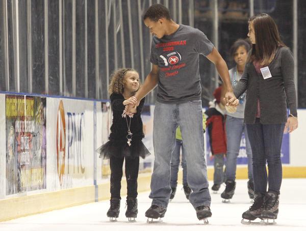The Vindicator/Lisa-Ann Ishihara --- L-R Destini Gray (5) with her older brother Deven (14) Gray along with Veronica Dorbish (14) - all of Austintown - ice skate at the Covelli Centre for First Night Youngstown 2010