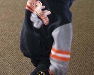 The Vindicator/Lisa-Ann Ishihara ---Beau Gorby (6) of Boardman plays Wii bowling on the suite level at the Covelli Centre for First Night Youngstown 2010
