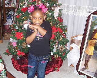 Charnae Mitchel spent Christmas Eve at the home of her great-grandmother, Sandra Allen Bowman of Youngstown.