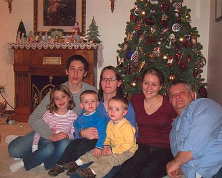 Spending Christmas at “Grandma Beth” Hatalsky’s home in Mineral Ridge, were, from left, Ryan; mom, Catherine; Bethany; dad, Don; Anna; and twins, Mark and Sean, from Olmsted Falls.