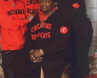 The Poindexters — Lil Allen, Dontrel, Allen Sr. and Debbie — of Youngstown pose in front of their Christmas tree.