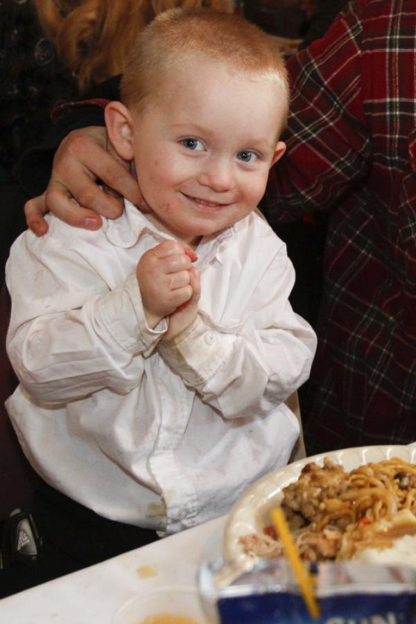 The Vindicator/Lisa-Ann Ishihara -- Bobby Cline (2) of Warren enjoys the holiday feast at Aulizio's Banquet Center in Warren for the free christmas dinner