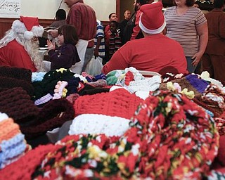 The Vindicator/Lisa-Ann Ishihara -- Santa visits at Aulizio's Banquet Center in Warren during the free christmas dinner