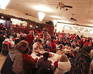The Vindicator/Lisa-Ann Ishihara -- Aulizio's Banquet Center in Warren during the free christmas dinner