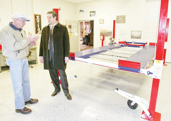 Larry Gross owner of Backyard Buddy in Warren talks with Congressman Tim Ryan Monday at Gross's showroom on Dana Streer in Warren. Gross says cheap imports from China have hurt his business.