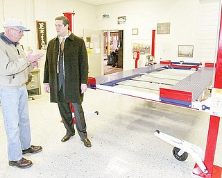 Larry Gross owner of Backyard Buddy in Warren talks with Congressman Tim Ryan Monday at Gross's showroom on Dana Streer in Warren. Gross says cheap imports from China have hurt his business.