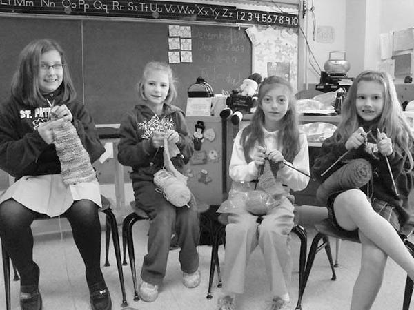 Special to The Vindicator
YOUNG KNITTERS: Students at St. Patrick School in Hubbard are learning a hobby that will make the wintry days warmer for some area residents. Under the tutelage of Elaine Scott, a first-grade teacher, they belong to an after-school knitting club. It meets once a week and is open to all grades and to parents. The youngsters already made seven scarves, which will be donated to the Rescue Mission. Among those enjoying the needlecraft are, from left, Kelly Wydolsky, Kayla Beil, Nicole DeLuca and Carly Siciliano.                                