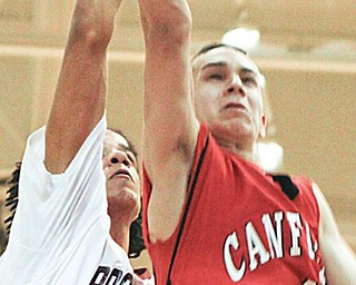 Canfield Dan Campolito (4) blocked by Boardman Dayne Hammond (24) during the second period at Boardman High School.
