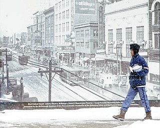 WINTER WHITE: Though the holidays are over, the winter snow season has just begun. Snow has been falling in the Mahoning Valley for several days now, and forecasts show no sign that it will let up over the next week. Leslie Glover, who delivered mail on foot in downtown Youngstown Tuesday, said she's been doing the job for 24 years and doesn't mind the weather.