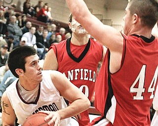 NOWHERE TO GO: Boardman guard Ben Mathey, left, gets blocked in by Canfield defenders Ryan Abraham (10) and Donnie Allison during the first quarter of Tuesday’s game at Boardman High.