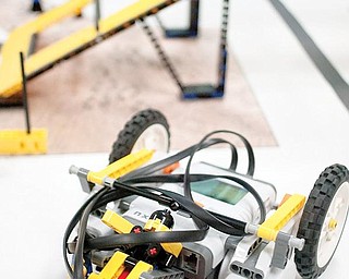 A WINNER: Lizzy the robot, made of Legos and guided by a microcontroller, won the Quality Design Award for the Lego Lizards of Girard Junior High School during regional robotics competition in Canton. The small ball in the front of the robot enhances Lizzy’s maneuverability.