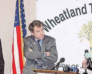 STEEL UPDATE: U.S. Sen. Sherrod Brown, D-Ohio, and U.S. Rep Tim Ryan listen as Roger Lindgren, president of V&M Star, explains a recent trade ruling. They spoke at a press conference Thursday at Wheatland Tube’s Warren plant.