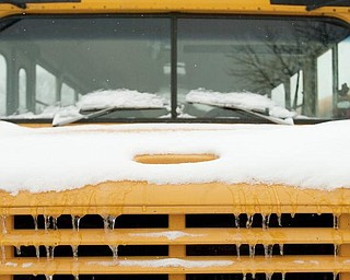 The Vindicator/Geoffrey Hauschild
A parking lot full of snow covered buses at the Youngstown Board of Education's Bus Depot on Friday afternoon.