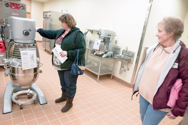 Tammy Swank, and mother, Gloria Damron, inspect a new kitchen area at the MCCTC on Sunday afternoon. Tammy's son, Ryan, has been enrolled at MCCTC for two years currently studying horticulture and carpentry but may also take culinary classes. 