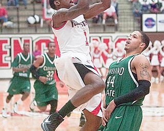 YSU DeAndre Mays (1) scores two against Cleveland State's Aaron Pogue (44) during the first half of a game at YSU's Beeghley Center on Saturday evening.