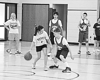 Special to The Vindicator
GAME PLAN: Students at St. Patrick School in Hubbard had a goal in mind when they arranged a benefit basketball game for Dec. 18. Above are some of the seventh- and eighth-grade boys and girls as they played the game. The entire student body also became involved in the fundraising event. Each student paid a dollar not to wear a school uniform that day and spent the morning cheering for their favorite players. Family members made a donation at the door when they came to watch the game. As is their tradition, the seventh-and eighth-grade classes donated the proceeds netted from the event to a family from the school that experienced adversity during the past year.

