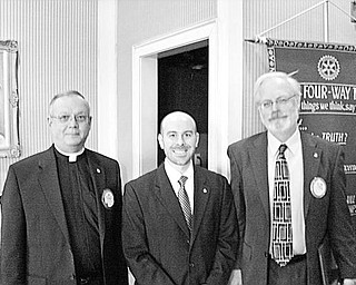 Special to The Vindicator
RECOGNIZED:  Four members of Youngstown Rotary Club were singled out for recognition at the club’s Jan.6 meeting. Each received a Paul Harris Fellow award in appreciation of their assistance in furthering friendly relationships among the people of the world. Three of the recipients are, above from left, Monsignor Robert Siffrin, Mark Mazzella, CPA, and Atty. Jim Blomstrom. The other recipient, not pictured, is Carlton Sears, director of Mahoning County Library. The program was presented by District 6650 Governor Douglas Simpson and Dallas Woodall, who spoke about the Rotary International Foundation, which sponsors such things as safe water projects in developing countries and promotes education and fellowship throughout the world. 

