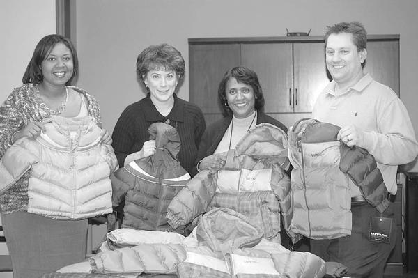 Special to The Vindicator
WARMING TREND: A $1,000 donation approved by the executive board of Boardman Rotary Club and skillful bargain-shopping by Rotarian Ryan Cuffle resulted in the purchase of 58 brand-new winter coats for children in the MYCAP Head Start program. Cuffle took the donation to Kohl’s, where he opened a credit card account, giving him an additional 10 percent off purchases, used a 30 percent off code provided by a fellow Rotarian, and received an additional $160 Kohl’s cash on the original purchase of the coats. Showing some of the gift coats are, above from left, Kavon Wright, manager of Head Start Family Service; Judy Miller, assistant director of Head Start; Lois Clark, director of Head Start; and Cuffle.