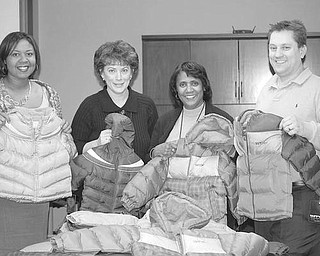 Special to The Vindicator
WARMING TREND: A $1,000 donation approved by the executive board of Boardman Rotary Club and skillful bargain-shopping by Rotarian Ryan Cuffle resulted in the purchase of 58 brand-new winter coats for children in the MYCAP Head Start program. Cuffle took the donation to Kohl’s, where he opened a credit card account, giving him an additional 10 percent off purchases, used a 30 percent off code provided by a fellow Rotarian, and received an additional $160 Kohl’s cash on the original purchase of the coats. Showing some of the gift coats are, above from left, Kavon Wright, manager of Head Start Family Service; Judy Miller, assistant director of Head Start; Lois Clark, director of Head Start; and Cuffle.