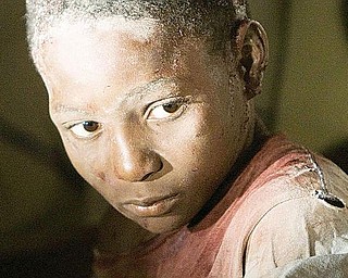 TENDING WOUNDS: An injured boy is tended to at the Hotel Villa Creole in Port-au-Prince, Haiti, after a 7.0-magnitude earthquake hit the Caribbean nation Tuesday.