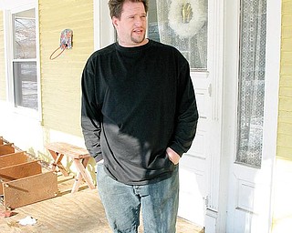 TOOK A STAND: Eric Collins, 31, of Washington Street in Warren, describes the confrontation he had with three young men Wednesday near his home.