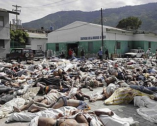 Hundreds of bodies of earthquake victims lay outside the morgue in Port-au-Prince, Thursday, Jan. 14, 2010. A 7.0-magnitude earthquake struck Haiti Tuesday.