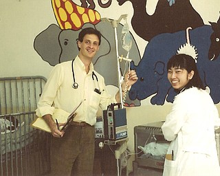 Scott Agnew, M.D. in Pediatrics ward with medical student at Hôpital Lumière (the Hospital of Light) in Bonne Fin, Haiti, about 100 miles west of Port-au-Prince.