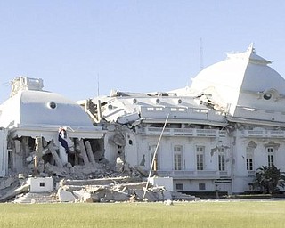 Haiti's National Palace is seen damaged in Port-au-Prince, Wednesday, Jan. 13, 2010. A powerful earthquake struck the country on Tuesday.