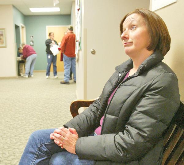 TIME FOR A CHANGE: Debbie James, 45, of Champion, waits at the Trumbull One-Stop Center. She hopes federal retraining funding will pay for her to complete her bachelor's of business administration at Kent State University. The wife and mother of three has been laid off from the accounting department at Severstal Warren since August 2009.