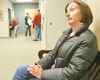 TIME FOR A CHANGE: Debbie James, 45, of Champion, waits at the Trumbull One-Stop Center. She hopes federal retraining funding will pay for her to complete her bachelor's of business administration at Kent State University. The wife and mother of three has been laid off from the accounting department at Severstal Warren since August 2009.