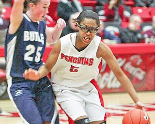 GUARD DOG: Canfield's Jillian Halfhill, back, watches as teammate Cally Wollet (3) tries to take the ball from Poland's Abby Brenoel (11) during Saturday's game at Canfield High School. The Cardinals proved too much for the Bulldogs, winning 59-27.