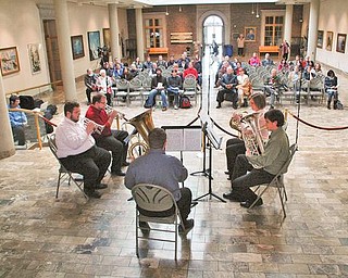 The Vindicator/Robert K. Yosay -----
The College of Fine and Performing Arts - Dana Concert Series presents Music at Noon Concert Series kicked off at the Butler Institute of American Art as part of the Brown Bag Concert series , Every Wednesday at Noon at the Butler . Today was Chamber Music for Brass Quintets.- Eric jernigan warms up on his Tuba under the watchful eye of "the baseball player by 'Marc Sijan-1999' at the Butler.The Vindicator/Robert K. Yosay -----
The College of Fine and Performing Arts - Dana Concert Series presents Music at Noon Concert Series kicked off at the Butler Institute of American Art as part of the Brown Bag Concert series , Every Wednesday at Noon at the Butler . Today was Chamber Music for Brass Quintets.- starting closest to camera in the pink is Deborah McDowell- Andrew Barnes- (green)- Eric Jernigan Frederick Moose and David Gardner.