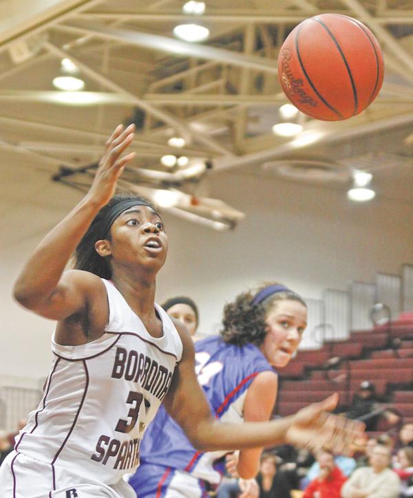 GAME ACTION: Boardman’s Doriyon Glass (33), above,  goes for the rebound before it goes out of bounds against Uniontown Lake during Wednesday’s game. The Spartans defeated Federal League rival Uniontown Lake 65-37.
