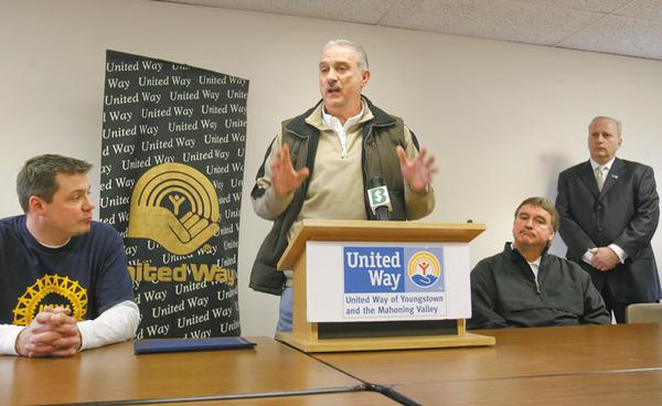 GOAL REACHED: Jim Graham, at the podium, president of United Auto Workers Local 1112 at the General Motors Lordstown Complex, explains how union workers helped the United Way of Youngstown and the Mahoning Valley exceed its 2009 financial goal of $2.5 million. Also appearing at Wednesday’s press conference were, from left, David Green, president of UAW Local 1714 at Lordstown; John Donahoe, manager of the complex and 2009 campaign chairman; and Robert Hannon, UW president and chief professional officer.
