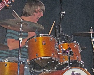 Boardman High School senior Mike Landgraff wails on the drums during Genghis Khan's performance at the Battle of the Bands on Jan. 16. His band landed in second place.
