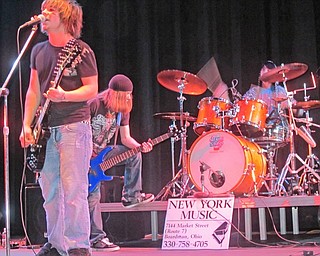 Battle of the Band winners Sinful Faith puts on a show for fans and spectators in the Boardman Performing Arts Center. Nick Deemer (left), Aaron Mannion (center) and Dylan Reid are all students of Boardman High School.