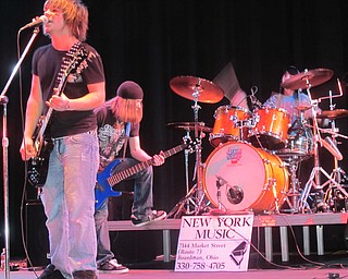 Battle of the Band winners Sinful Faith puts on a show for fans and spectators in the Boardman Performing Arts Center. Nick Deemer (left), Aaron Mannion (center) and Dylan Reid are all students of Boardman High School. 
