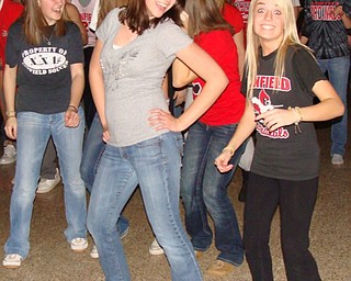 Kristin Pettola (left) and Taylor Dorman didn't shy away from the camera as they show off a few dance moves at the Canfield High School Sock Hop Jan. 18.
