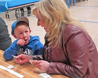 Sentences are fun with this word sorting activity. Mason Planey (left) consults his mother, Kelly Planey, to make sure his sentence is correct.