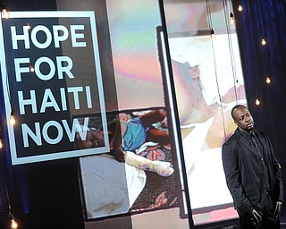 In this image released by Hope for Haiti Now,  Wyclef Jean speaks at "Hope for Haiti Now: A Global Benefit for Earthquake Relief", on Friday, Jan. 22, 2010, in New York. (AP Photo/Evan Agostini/Hope for Haiti Now)