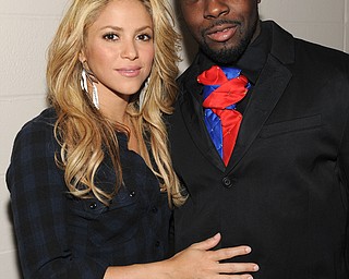 In this image released by Hope for Haiti Now, Shakira, left, and Wyclef Jean pose backstage at "Hope for Haiti Now: A Global Benefit for Earthquake Relief", on Friday, Jan. 22, 2010, in New York. (AP Photo/Evan Agostini/Hope for Haiti Now)