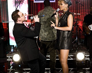 In this image released by Hope for Haiti Now, Bono, left, and Rihanna perform at the "Hope for Haiti Now: A Global Benefit for Earthquake Relief", Friday, Jan. 22, 2010 in London. (AP Photo/MJ Kim/Hope For Haiti Now)